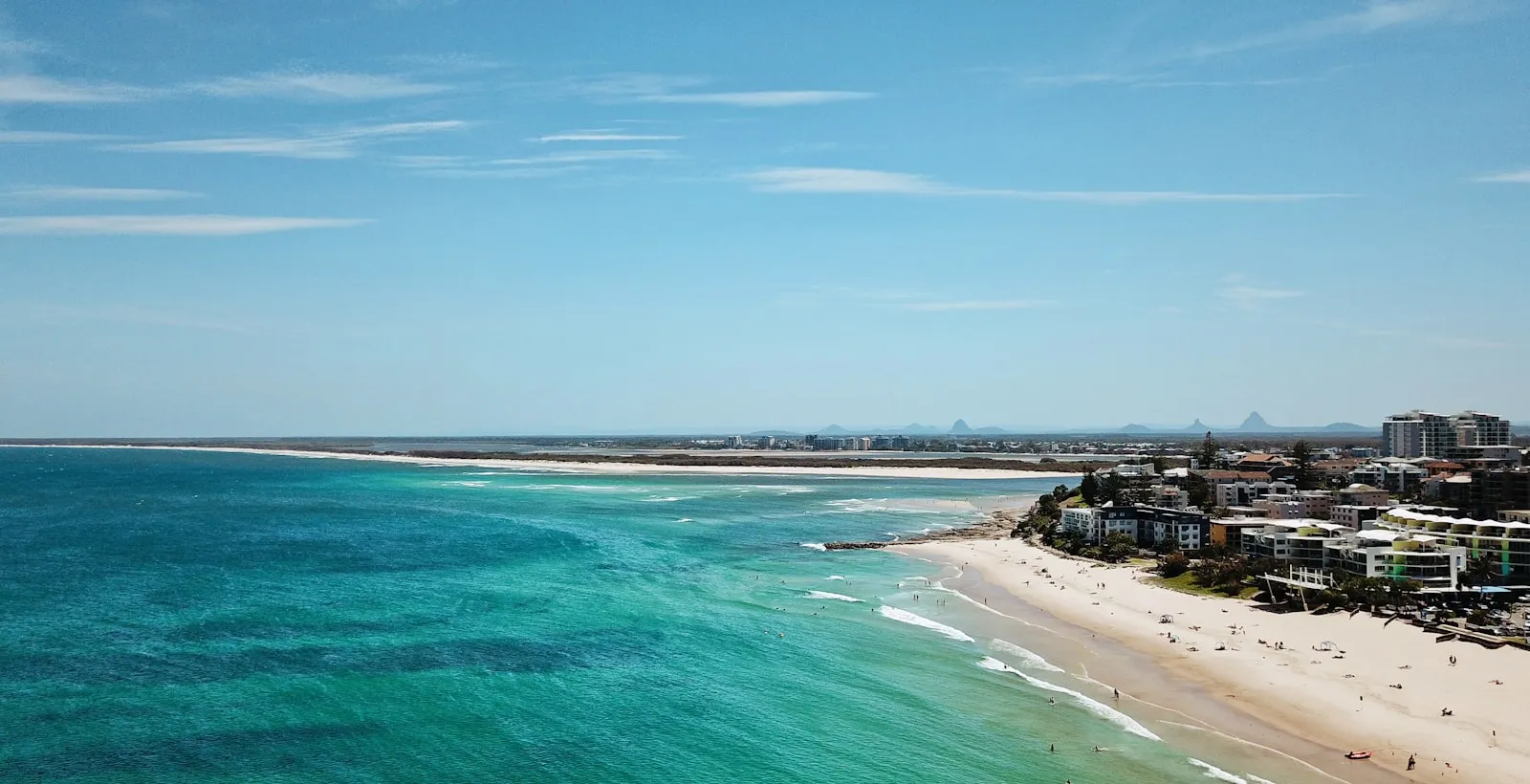 Aerial view of Kings Beach Caloundra on the Sunshine Coast with the Glass House Mountains on the horizon